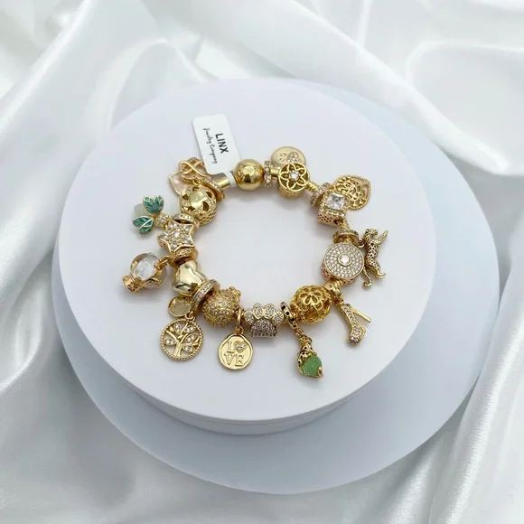 Linx Yellow Gold Bracelet with Gold and Green Themed Charms